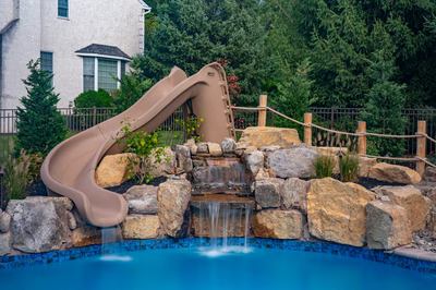Abiqua B - Doylestown, PA - A pool with a water feature and a slide in a backyard setting