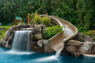 Antelope C - Ringoes, NJ - A water feature with a slide in a backyard setting