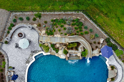 Antelope J - Ringoes, NJ - A bird's eye view of a backyard with a swimming pool and a water feature
