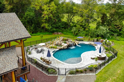 Antelope K - Ringoes, NJ - A backyard with a swimming pool surrounded by lush greenery and trees
