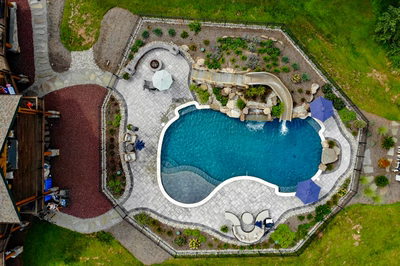 Antelope L - Ringoes, NJ - A bird's eye view of a backyard with a swimming pool and a water feature