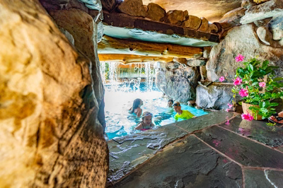 Aquatopia Q - Williamstown, NJ - A group of children playing in a pool with a waterfall in the background