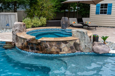 Aquatopia W - Williamstown, NJ - A bird's eye view of a backyard with a swimming pool surrounded by lush greenery