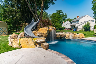 Augrabies D - West Deptford, NJ - A backyard with a pool and a water feature with a slide