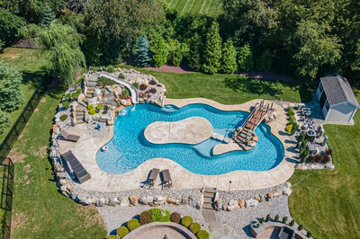 Bagley T - Williamstown, NJ - A bird's eye view of a backyard with a swimming pool surrounded by lush greenery