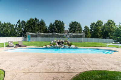 Beach B - Lumberton, NJ - A backyard with a pool and a fence surrounding it.