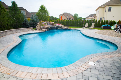 Bearcamp G - Mechanicsburg, PA - A backyard with a swimming pool and a waterfall.