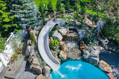 Benham J - Cape May Courthouse, NJ - A backyard with a water feature and a water slide