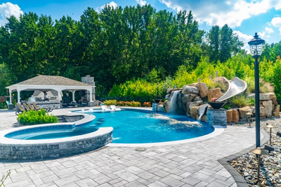 Berlin J - Robbinsville, NJ - A beautiful backyard with a swimming pool and a gazebo surrounded by lush greenery