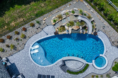 Berlin M - Robbinsville, NJ - A bird's eye view of a swimming pool surrounded by landscaping