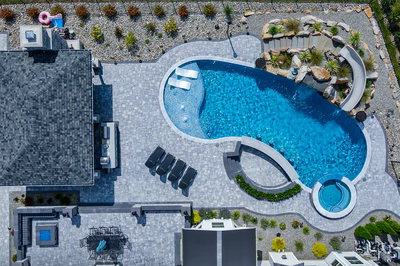 Berlin N - Robbinsville, NJ - A bird's eye view of a backyard with a swimming pool surrounded by landscaping