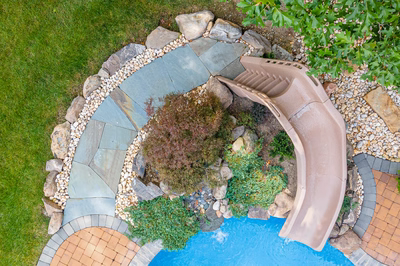 Blackwater K - Monroe, NJ - A bird's eye view of a backyard with a water feature and landscaping