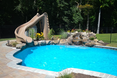 Bristol B - Hamilton, NJ - A swimming pool with a water feature and a slide in a backyard setting