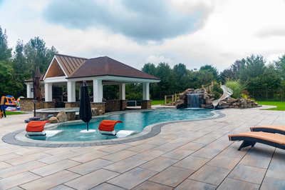 Bruar K - Millstone, NJ - A backyard with a pool and a gazebo surrounded by lush greenery