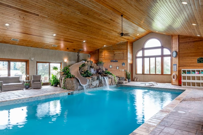 Bumpass J - Monroeville, NJ - A large indoor swimming pool with a water feature in the middle of it