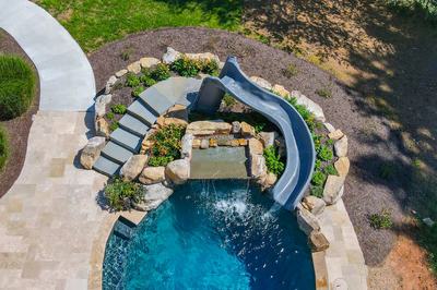Burney - Matawan, NJ - A swimming pool with a water feature and a water slide in a backyard setting