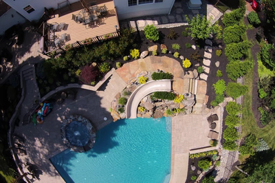 Campbell B - Audubon, PA - A bird's eye view of a backyard with a swimming pool and landscaping