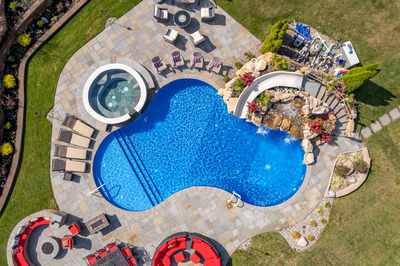 Chania P - Hamilton, NJ - A bird's eye view of a backyard with a swimming pool and landscaping