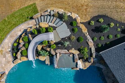 Cispus L - Mantua, NJ - A bird's eye view of a backyard with a swimming pool and a water feature