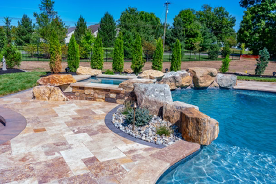 Cispus Q - Mantua, NJ - A backyard with a swimming pool surrounded by lush greenery and trees