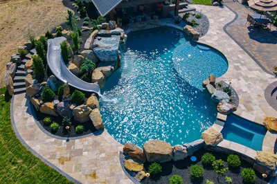 Cispus V - Mantua, NJ - A large backyard with a swimming pool and a water feature