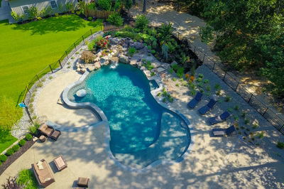 Coal F - Vincentown, NJ - A bird's eye view of a backyard with a swimming pool and landscaping