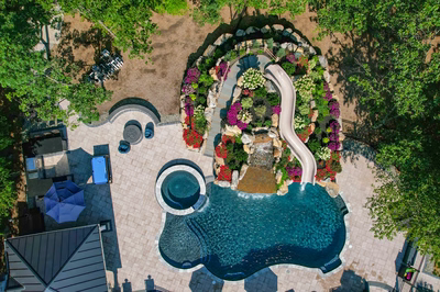 Copper O - Cream Ridge, NJ - A bird's eye view of a backyard with a swimming pool surrounded by lush greenery