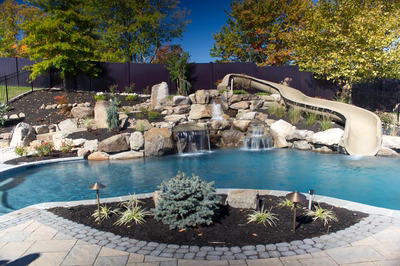 Crystal A - Flemington, NJ - A backyard with a pool and a water feature with a slide