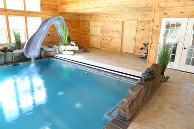 Cypress D - Bridgeton, NJ - A large indoor swimming pool with a water slide in the middle of it