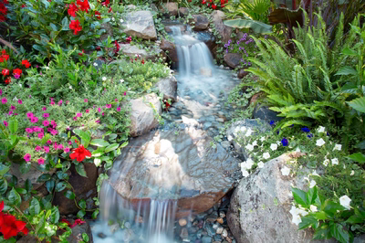 Daintree E - Spring City, NJ - A small waterfall surrounded by colorful flowers and rocks