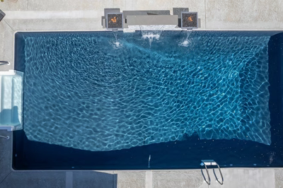 Dune P - Brigantine, NJ - A rectangular swimming pool with clear blue water and ripples, viewed from above