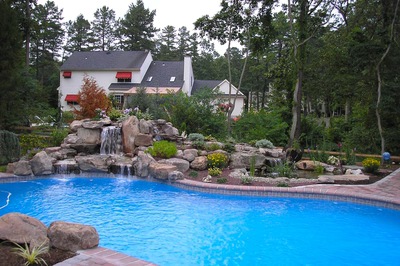 Fairy A - Shamong, PA - A large backyard with a swimming pool and a waterfall.