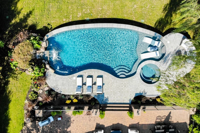 Faxi F - Moorestown, NJ - A bird's eye view of a swimming pool surrounded by lush greenery