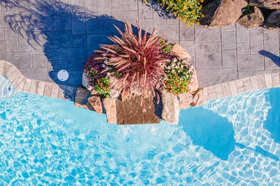 Franconia C - Malvern, PA - A bird's eye view of a swimming pool surrounded by flowers and rocks