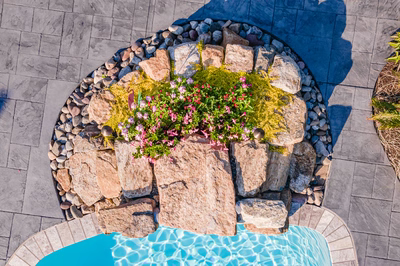 Franconia L - Malvern, PA - A bird's eye view of a rock garden with flowers by a swimming pool