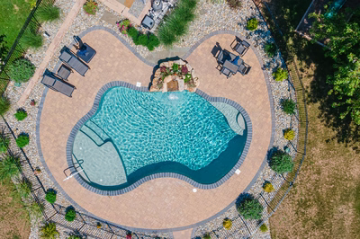 Georgiana J - Hillsborough, NJ - A bird's eye view of a swimming pool surrounded by lush greenery