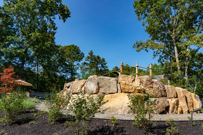 Gikira H - Bethlehem, PA - A large rock structure surrounded by trees in a park setting
