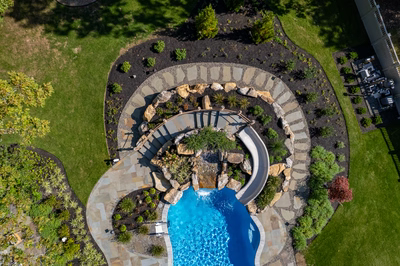 Gikira L - Bethlehem, PA - A bird's eye view of a backyard with a swimming pool and landscaping