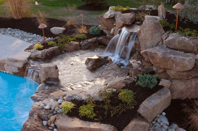 Harvard C - Sewell, NJ - A small waterfall in a rock garden next to a swimming pool