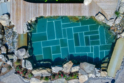 Havasu Z - Manasquan, NJ - A bird's eye view of a swimming pool surrounded by rocks and greenery