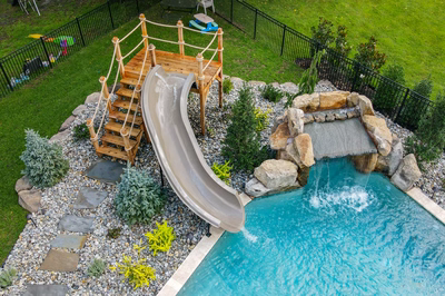 Horsetail O - Marlton, NJ - A backyard with a water feature and a wooden play structure