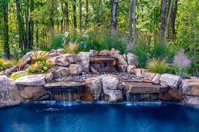 Howick C - Ivyland, PA - A natural swimming pool with a waterfall surrounded by lush greenery