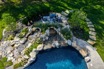 Howick L - Ivyland, PA - A bird's eye view of a backyard with a swimming pool and a waterfall