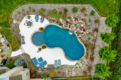 Juba J - Flemington, NJ - A bird's eye view of a backyard with a swimming pool surrounded by landscaping