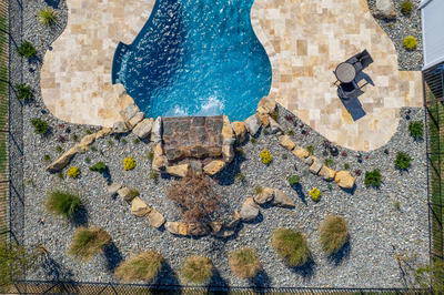 Kamui I - Phoenix, MD - A bird's eye view of a backyard with a swimming pool and landscaping