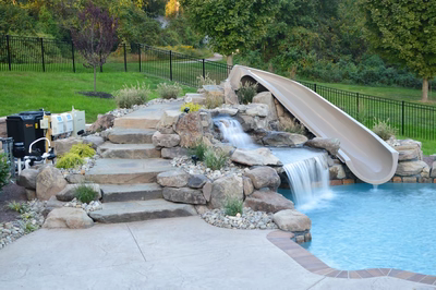 Kedron E - Thorton, PA - A backyard with a water feature and a water slide