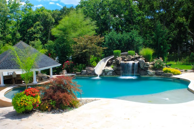 Linton E - Galloway, NJ - A beautiful backyard with a swimming pool and a waterfall.