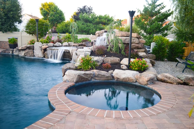 Lisbon J - Marlton, NJ - A backyard with a swimming pool and a waterfall feature