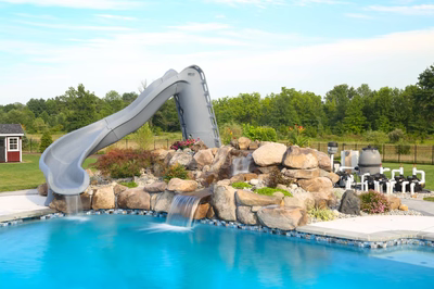 Loowit A - Ringoes, NJ - A swimming pool with a water feature and a slide in a backyard setting