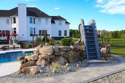 Loowit D - Ringoes, NJ - A large white house with a pool and a water feature in front of it